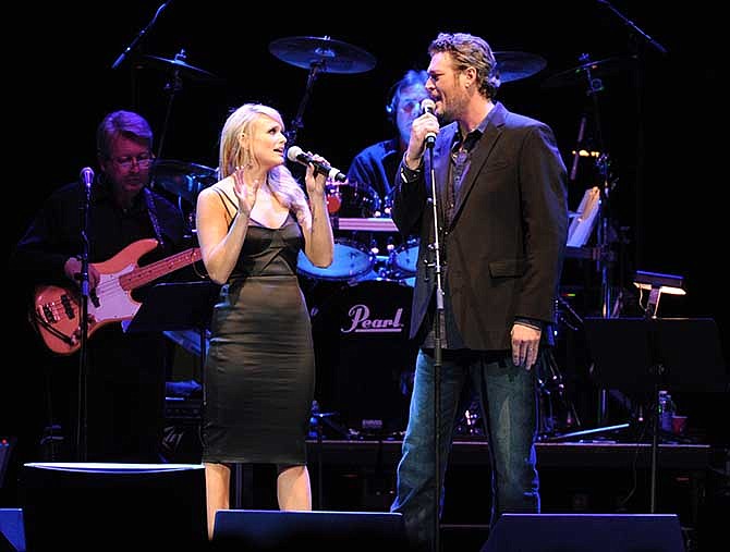 Miranda Lambert and Blake Shelton perform at the George Jones Tribute - Playin' Possum: The Final No Show, on Friday, Nov. 22, 2013, at the Bridgestone Arena in Nashville, Tenn. 