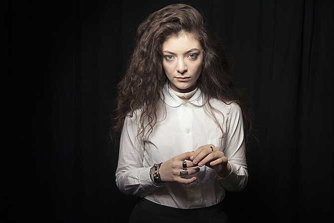 In this Nov. 8, 2013 photo, New Zealand singer Lorde poses for a portrait in New York. The 17-year-old singer has been anointed to the lofty position of pop's newest princess thanks to her astute hit song, "Royals."