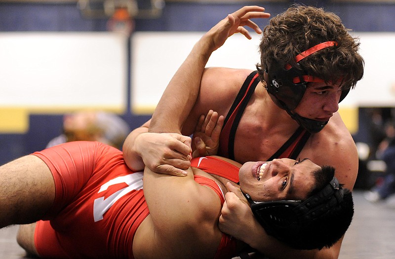 Jefferson City's Devin Miller wrestles Kirkwood's Nykhil Patel in a 152-pound match Friday at the Missouri Duals at Helias Gym.