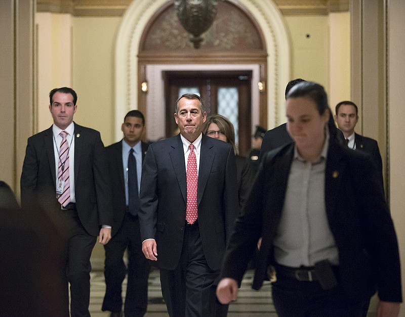 Speaker of the House John Boehner, R-Ohio, leaves the chamber Thursday as the House holds final votes before leaving for the holiday recess, at the Capitol in Washington. 
