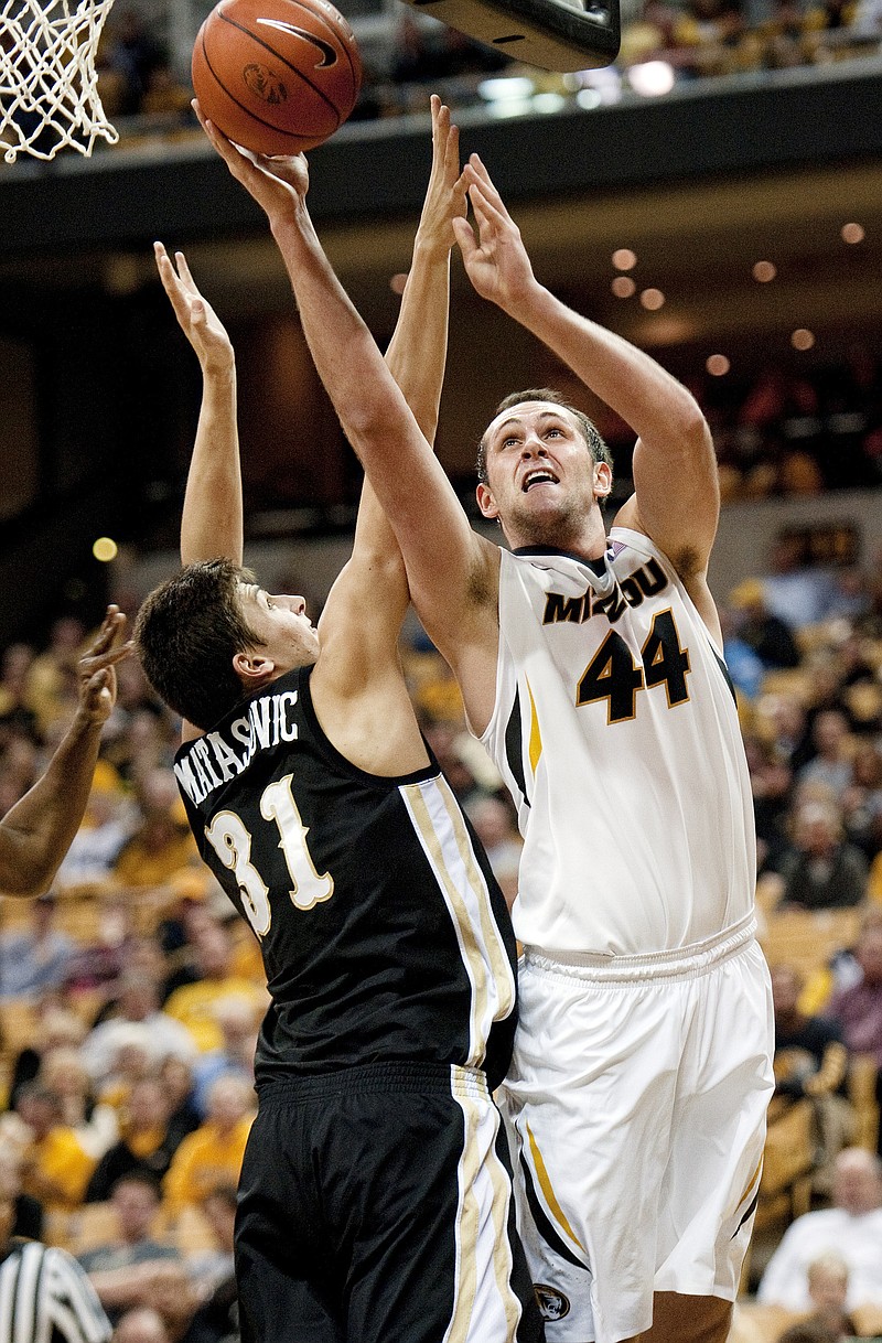 Missouri's Ryan Rosburg puts up a shot while being defended by Western Michigan's Mario Matasovic during Sunday night's game in Columbia.