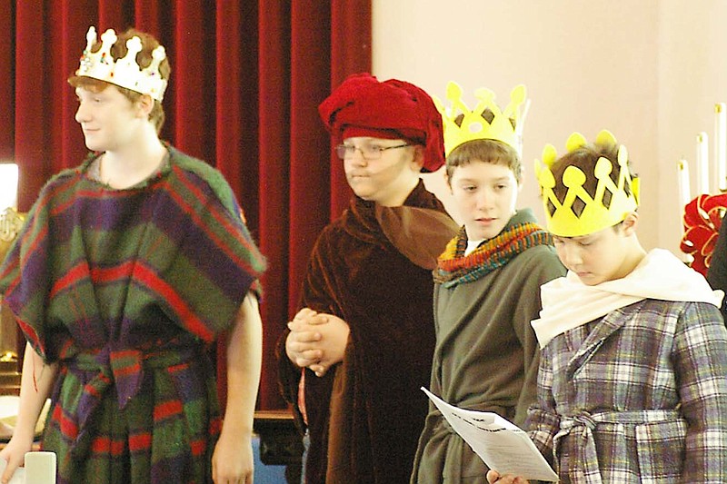 Herod (Matt Stewart) gives instructions to the three wise persons (Will Parr, Luke Stewart, Tim Stewart) at the PHUMC Christmas Program on Sunday morning.