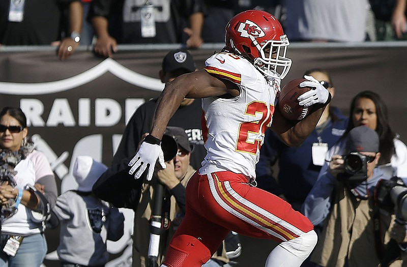 Chiefs running back Jamaal Charlees heads toward the end zone on a 49-yard touchdown reception Sunday against the Raiders in Oakland, Calif.