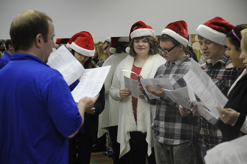 To add to the holiday cheer of the Russellville Indian Singers Christmas tour, members Kimberly Willis, Whitney Vanwechel, Robert Geffman and Devin Koestner wore plush elf hats as they sang well-known Christmas favorites Tuesday, Dec. 10. Democrat photo/Michelle Brooks
