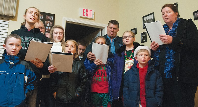 Carolers with the Southside Baptist Church in Fulton sing Christmas songs to residents at the Churchill Terrace Assisted Living Center on Wednesday. The group also sang at Fulton Presbyterian Manor and the private homes of two widows from their church.
