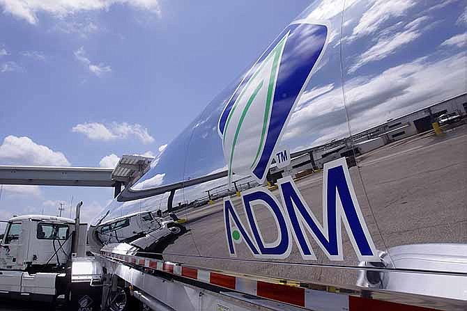 This July 2, 2009, file photo shows the Archer Daniels Midland Company logo on a tanker truck at the ADM plant in Decatur, Ill. The agribusiness giant on Wednesday, Dec. 18, 2013 said it is moving its global headquarters to Chicago, but said it could still set up a new technology center in another state after failing to win millions in tax breaks. 