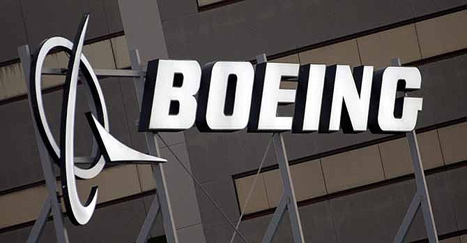 In this Jan. 25, 2011 file photo is the Boeing Company logo on the property in El Segundo, Calif.