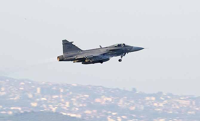  In this April 7, 2011 file photo, a Swedish JAS 39C Gripen fighter jet takes off from the Sigonella base in Sicily, Italy. Brazil's government said Wednesday, Dec. 18, 2013 that Sweden's Saab won a long-delayed fighter jet contract initially worth $4.5 billion that will supply at least 36 planes to Latin America's biggest nation. 