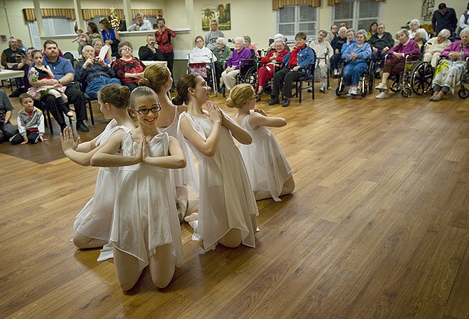 Dancers of the Jefferson City Dance Academy perform for a crowd of residents at Adams Street Place on Thursday evening. The academy has been performing at Adams Street Place annually for 30 years.