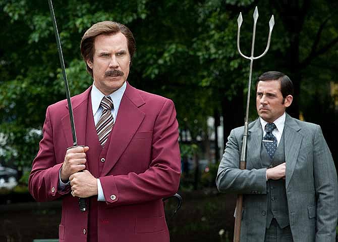 This image released by Paramount Pictures shows Will Ferrell as Ron Burgundy, left, and Steve Carell as Brick Tamland in a scene from "Anchorman 2: The Legend Continues." 