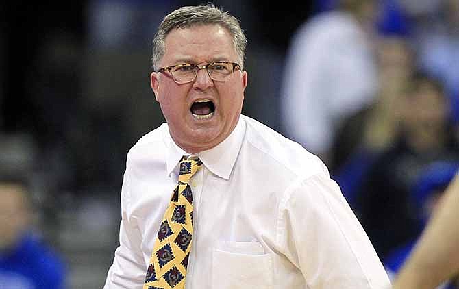 In this Feb. 19, 2013 file photo, Southern Illinois head coach Barry Hinson yells during the second half og an NCAA college basketball game against Creighton, in Omaha, Neb. Hinson lambasted his players after a loss at Murray State, calling them "uncoachable," a "bunch of mama's boys" and comparing disciplining his young team to housebreaking a puppy. 