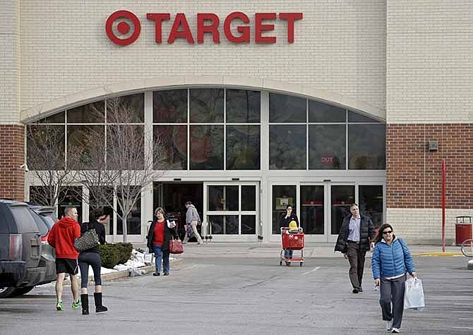 Shoppers leave a Target store in North Olmsted, Ohio Thursday, Dec. 19, 2013. 