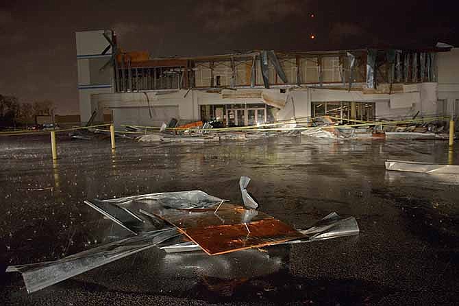 The Books-A-Million store is seen damaged by heavy wind and rain during a major storm in Monroe, La., Saturday, Dec. 21, 2013. 