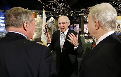 Capt. James A. Lovell Jr. center, speaks with President and CEO of Chicago's Museum of Science and Industry, David R. Mosena, right, and journalist Frank Mathie, left, Monday during 45th Anniversary of Apollo 8 "Christmas Eve Broadcast to Earth" event at the Museum of Science and Industry in Chicago.