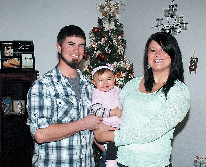 Democrat photo / April Arnett
Rylee Michelle Porter, with parents Brandon and Kaylee Porter, California, was the 2013 First Baby of Moniteau County Contest winner. She will celebrate her first birthday Wednesday, Jan. 1.