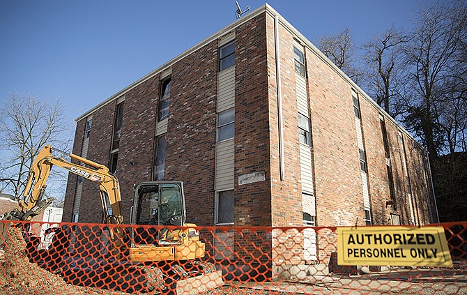 Demolition began Thursday at an apartment complex on the corner of Mulberry and Dunklin streets. The complex was condemned after a 2011 fire that left several residents without homes.