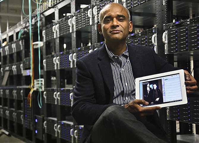  In this Thursday, Dec. 20, 2012, file photo, Chet Kanojia, founder and CEO of Aereo, Inc., shows a tablet displaying his company's technology, in New York. Aereo is one of several startups created to deliver traditional media over the Internet without licensing agreements. 