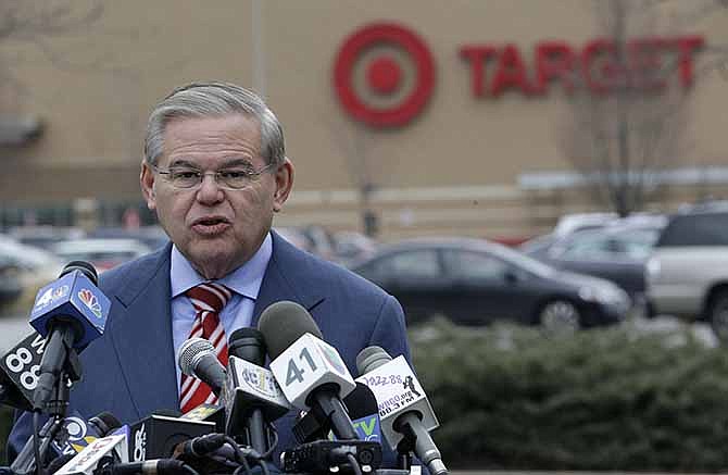 U.S. Sen. Robert Menendez talks during a news conference outside of a Target store, Thursday, Dec. 26, 2013, in Jersey City, N.J. Menendez, a member of the Senate banking committee, is laying out efforts to protect consumers' personal information, in light news that information from 40 million Target customers were stolen.