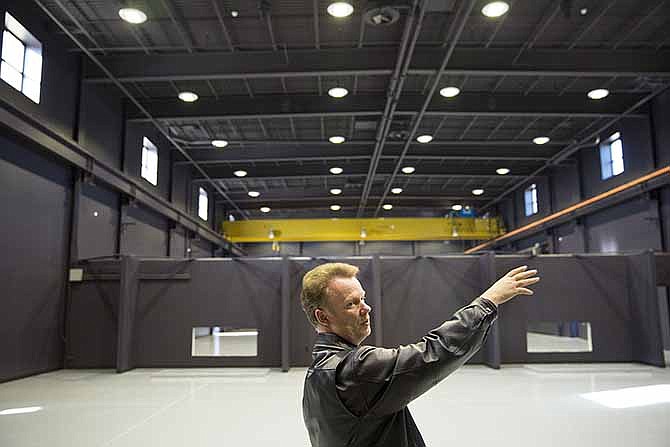 
Missouri Military Museum Director Charles Machon explains his plans for future exhibits while touring the new facility. 