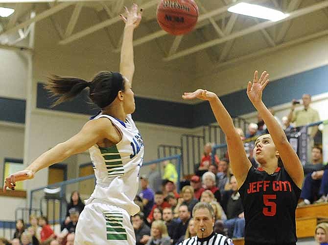 
Jefferson City's Hannah Nikodym shoots over Blue Springs South's Makayla Moore during Saturday's action in the Holiday Hoops Invitational at Rackers Fieldhouse.