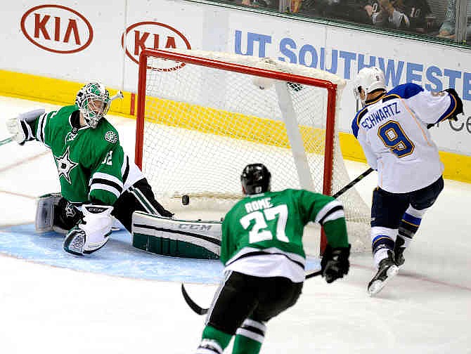 St. Louis Blues left wing Jaden Schwartz (9) scores past Dallas Stars goalie Kari Lehtonen (32) druing the first goal during an NHL hockey game, Sunday, Dec. 29, 2013, in Dallas. 