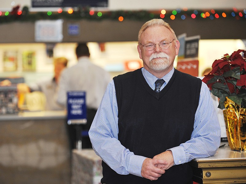 Soon-to-retire Postmaster Don Knoth, poses in the lobby of the downtown Jefferson City Post Office.
