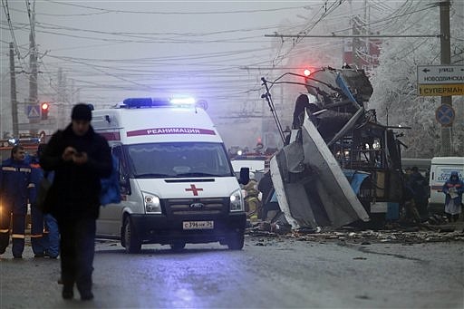An ambulance leaves the site of a trolleybus explosion Monday in Volgograd, Russia. The explosion left 14 people dead Monday, a day after a suicide bombing that killed at least 17 at the city's main railway. The explosions put the city on edge and highlighted the terrorist threat that Russia is facing as it prepares to host the Winter Games in February.