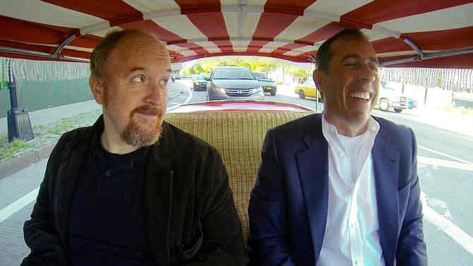 This image released by Crackle shows comedians Louis C.K., left, and Jerry Seinfeld in a scene from Seinfeld's new web series talk show "Comedians in Cars Getting Coffee." The series launched on the Crackle digital network in 2012, and its third season cranks up Thursday, Jan. 2, with Seinfeld joining Louis C.K. for a cup of joe after a zany ride on a clown-car-scale 1959 Fiat Jolly. 