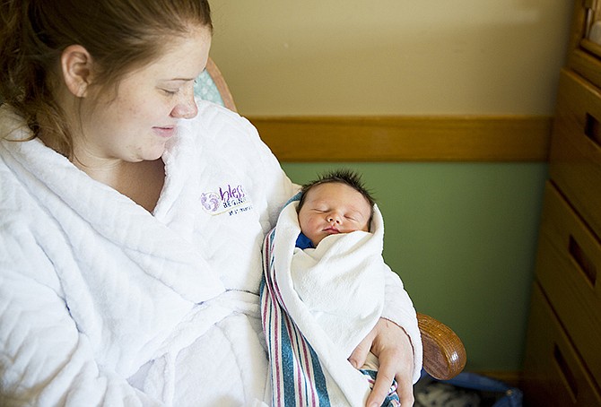 Caitlin Delaney, Eldon, holds her son, Zephan, the first 2014 baby born in Jefferson City. Zephan was born at 3:08 p.m. Wednesday at St. Mary's Health Center.