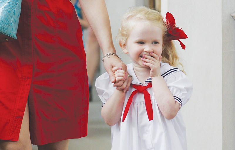 A young girl walks in the Church of St. Mary during a celebration of the royal baby in May.
