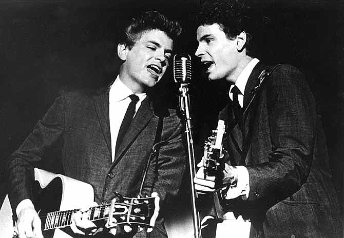  This July 31, 1964 file photo shows The Everly Brothers, Don and Phil, performing on stage. Phil Everly, who with his brother Don formed an influential harmony duo that touched the hearts and sparked the imaginations of rock 'n' roll singers for decades, including the Beatles and Bob Dylan, died Friday, Jan. 3, 2014. He was 74. Everly died of chronic obstructive pulmonary disease at a Burbank hospital, said his son Jason Everly. 