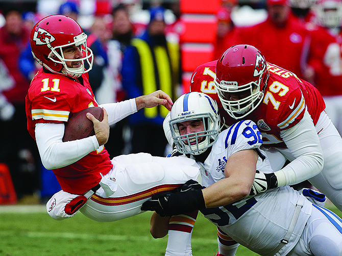 In this Dec. 22, 2013, file photo, Chiefs quarterback Alex Smith is sacked by Colts outside linebacker Bjoern Warner during the first half of a game at Arrowhead Stadium.