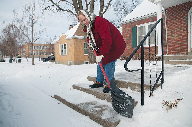 Pat Jennings, of Fulton, shovels the snow off of her steps and sidewalk in nine degree weather Thursday morning. Jennings said she needed to shovel the snow so her aunts, 80 and 82, could safely reach her home before they headed out to the casino in Boonville. She descibed the snow as powdery, and said she was thankful it wasn't very deep. "It could be a lot worse," Jennings said. A Winter Weather Advisory and Special Weather Statement was sent out by the National Weather Service that included Central Missouri. 