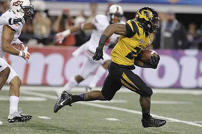 Missouri running back Henry Josey (20) goes in for a touchdown against Oklahoma State during the second half of the Cotton Bowl NCAA college football game, Friday, Jan. 3, 2014, in Arlington, Texas.