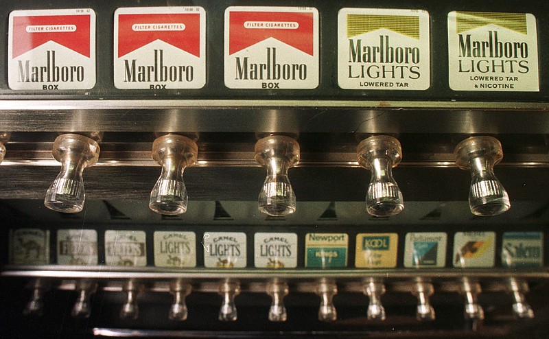 This Monday, Oct. 13, 1997 file photo shows a cigarette vending machine in a bar in Montpelier, Vt. 
