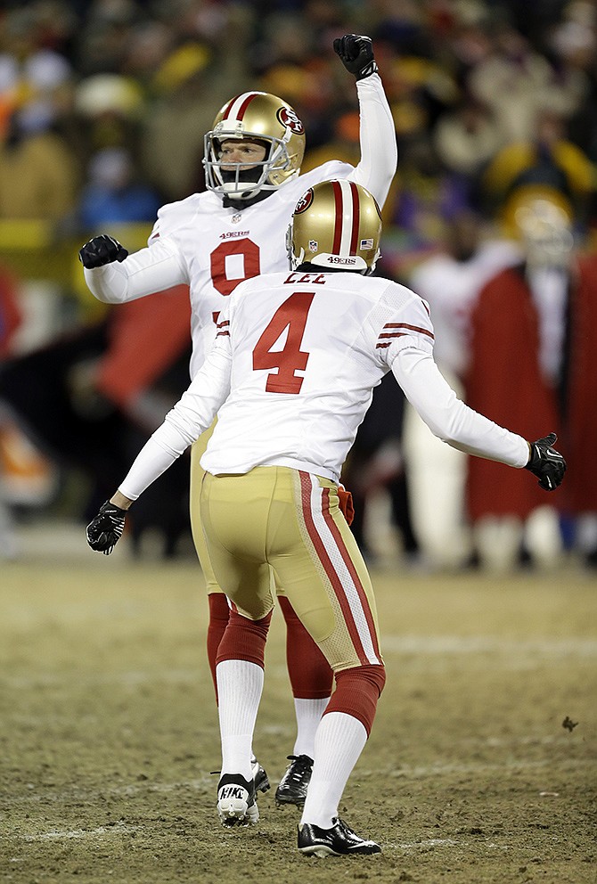 49ers kicker Phil Dawson (9) celebrates after kicking the game-winning field goal as time expired against the Packers during a wild-card playoff game Sunday in Green Bay, Wis. The 49ers won 23-20.