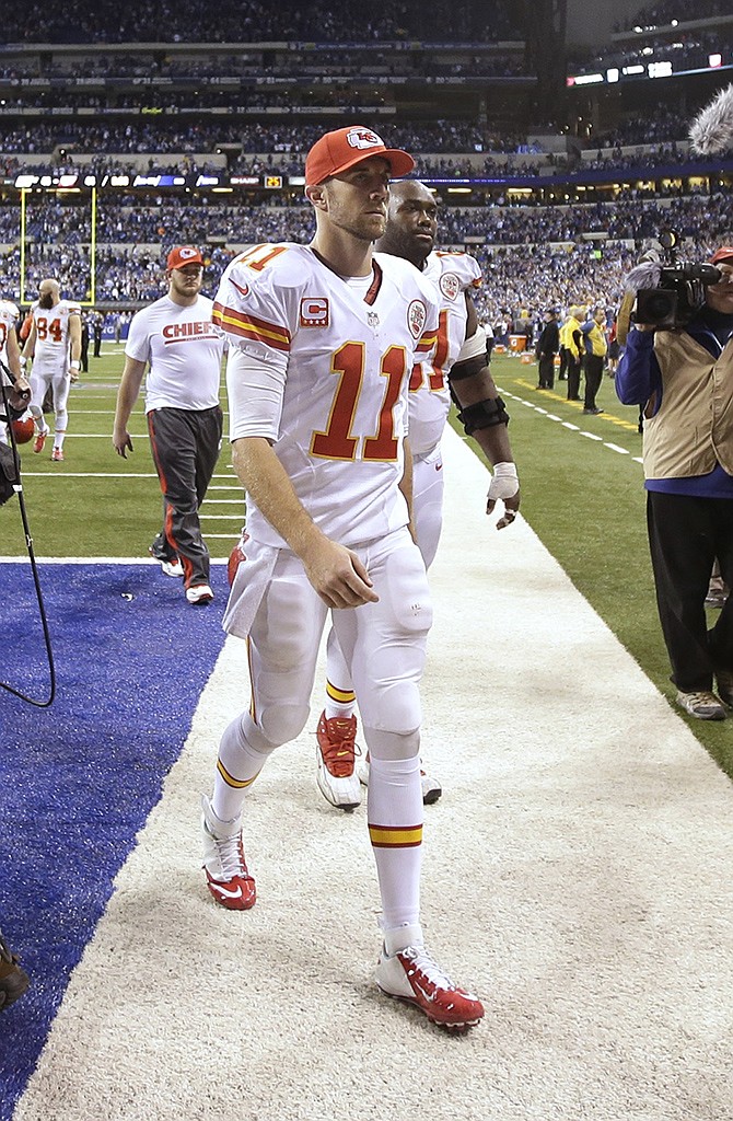 Chiefs quarterback Alex Smith (11) leaves the field after a wild-card playoff game against the Colts on Saturday in Indianapolis. Indianapolis defeated Kansas City 45-44. 