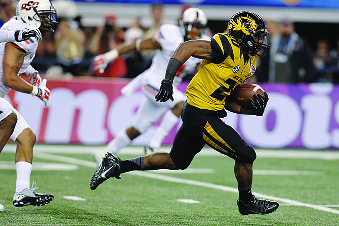 Missouri running back Henry Josey (20) goes in for a touchdown against Oklahoma State during the second half of the Cotton Bowl on Friday in Arlington, Texas.