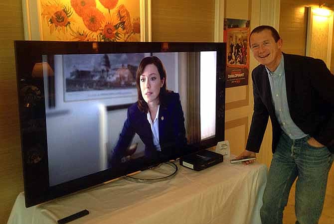 Neil Hunt, Netflix's chief product officer, demonstrates ultra high definition streaming of a "House of Cards" trailer on a Sony TV on the sidelines of the International Consumer Electronics Show in Las Vegas. Netflix says video streaming of its programming in ultra-high definition will work for buyers of new UHD sets from Sony, LG, Samsung, Vizio and others upon purchase.