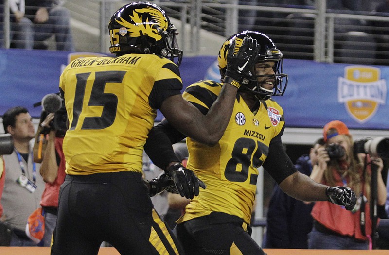Missouri wide receiver Dorial Green-Beckham (15) celebrates with teammate Marcus Lucas after Lucas' touchdown during the Cotton Bowl against Oklahoma State earlier this month in Arlington, Texas.