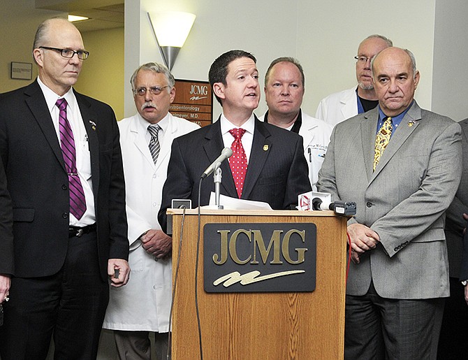 Flanked by fellow representatives and JCMG doctors, Missouri Speaker of the House Timothy Jones addressed the media about proposed legislation aimed at reinstating caps on lawsuits for medical malpractice. 