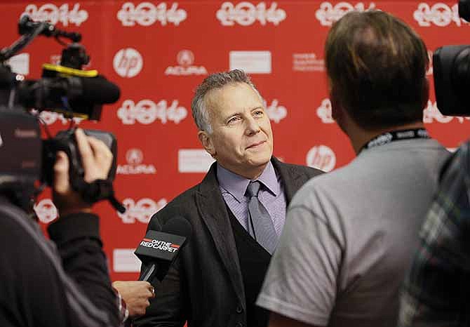 Cast member Paul Reiser is interviewed at the opening night premiere of the film "Whiplash" during the 2014 Sundance Film Festival, on Thursday, Jan. 16, 2014, in Park City, Utah.