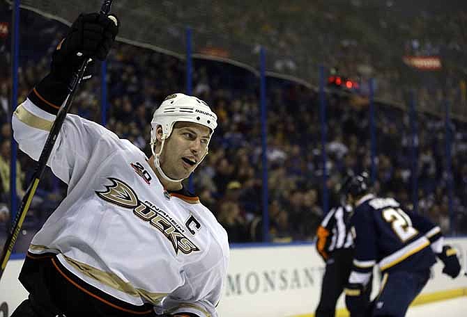 Anaheim Ducks' Ryan Getzlaf, left, celebrates after scoring as St. Louis Blues' Patrik Berglund, of Sweden, skates in the background during the first period of an NHL hockey game, Saturday, Jan. 18, 2014, in St. Louis.