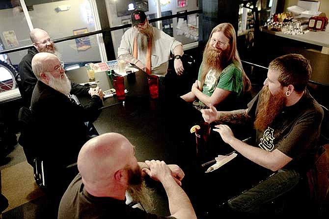 Jay Staley and Richie Darling, right, discuss their methods of beard grooming with other members at the first meeting of the Missouri Order of Beardsmen.