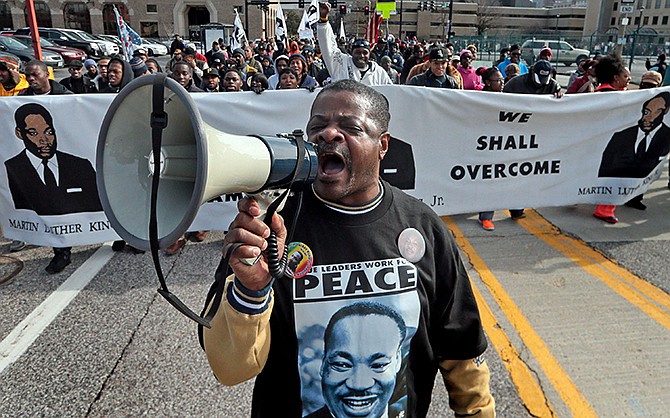 William Whittaker sparks up the crowd Monday with a chant of "We are the Marchers," during the March of Celebration honoring the Rev. Martin Luther King Jr. and his fight for equality in St. Louis. "I have been the voice of the march for the last 28 years. I still believe in the dream," said Whittaker.
