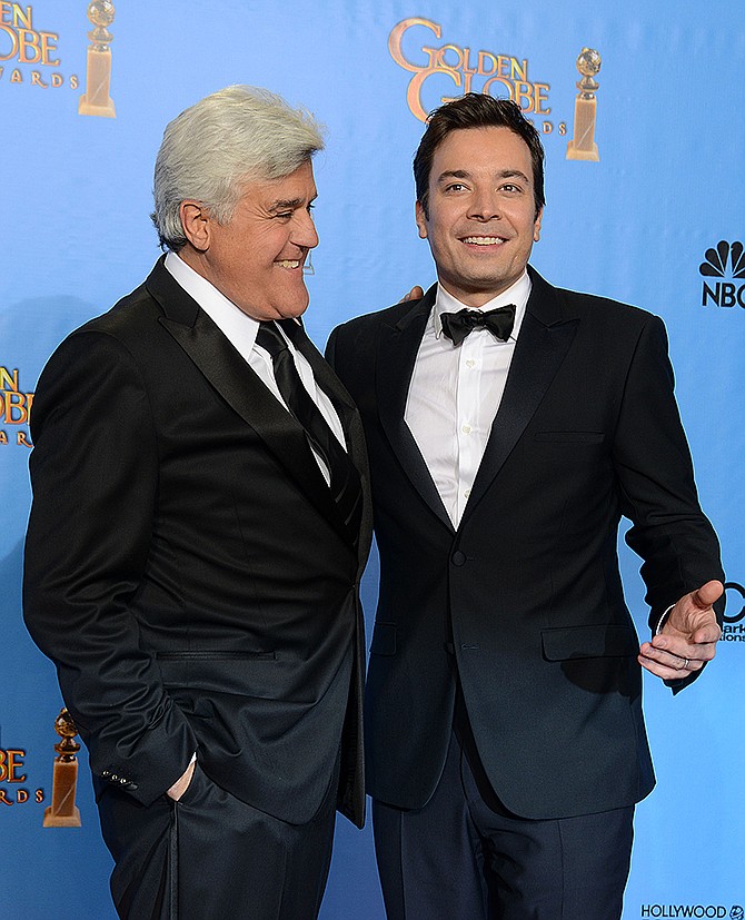 This January 2013 photo shows presenters Jimmy Fallon, right, and Jay Leno posing backstage at the 70th Annual Golden Globe Awards at the Beverly Hilton Hotel. Leno will close out his 22-year run as host of NBC's "The Tonight Show" with a nod to the future and to the past. Fallon, will kick off Leno's final week with a guest appearance on Feb. 3. Fallon is taking over the gig. 