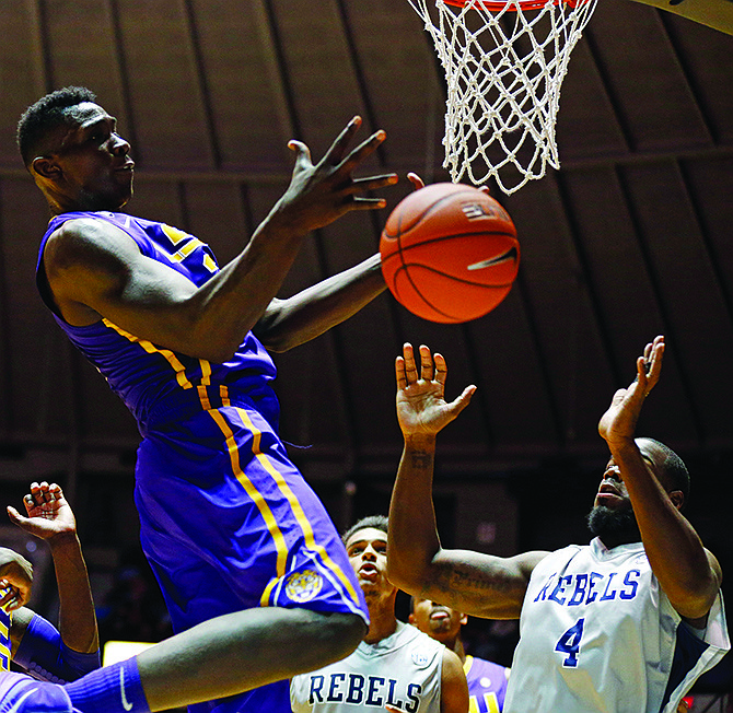 Johnny O'Bryant III of LSU (left) tries to pull in a rebound from Mississippi's Demarco Cox (4) during last Wednesday's game in Oxford, Miss.