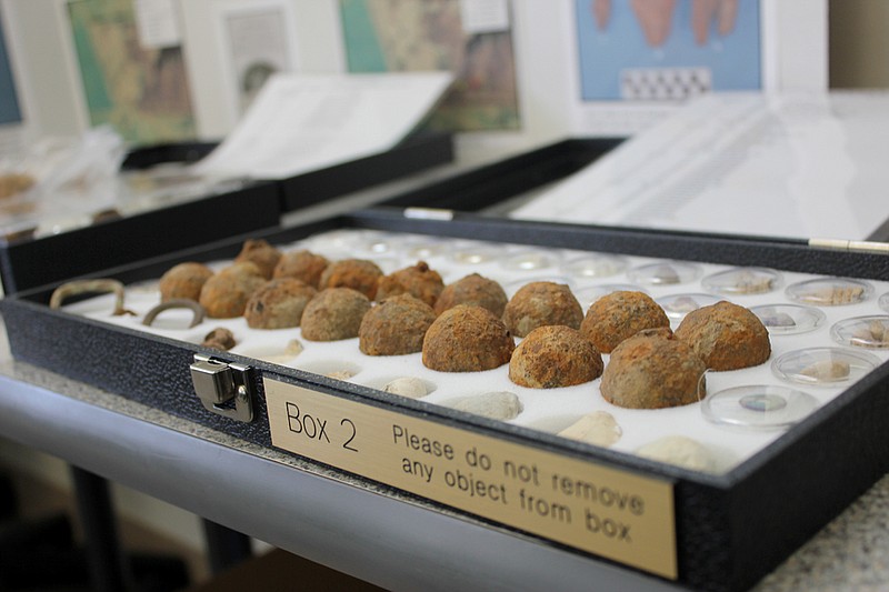 Canister balls recovered from the Battle of Moore's Mill site sit in a display case during a brown-bag presentation on last year's survey of the battlegrounds at Westminster College.