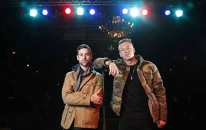 In this Tuesday, Nov. 20, 2012 file photo, American musician Ben Haggerty, better known by his stage name Macklemore, right, and his producer Ryan Lewis pose for a portrait, at Irving Plaza in New York. Macklemore & Ryan Lewis have seven nominations at Sunday, Jan. 26, 2014 Grammys, including best new artist, album of the year for "The Heist" and song of the year for "Same Love." 