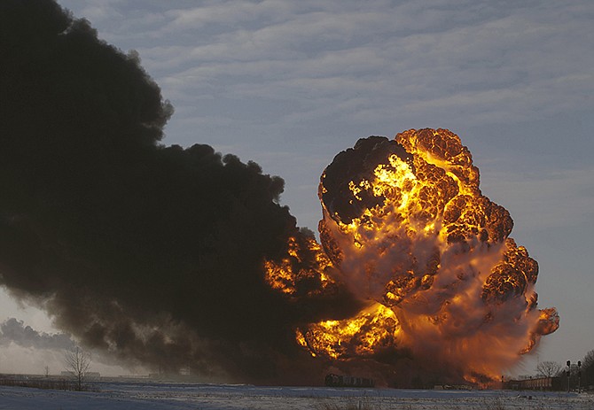 A fireball goes up Dec. 30, 2013, at the site of an oil train derailment in Casselton, N.D. Warning that a "major loss of life" could result from an accident involving the increasing use of trains to transport large amounts of crude oil, U.S. and Canadian accident investigators urged their governments to take a series of safety measures. 